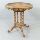 A 19th century walnut font, with carved decoration, and supported on quadruple barley twist