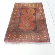 A red-ground Turkoman rug. 142x98cm.