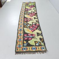 A Kilim runner. 275x67cm.