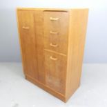 G-PLAN - a mid-century teak compactum wardrobe, with single door, three drawers and cupboard