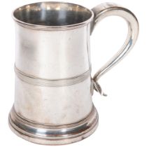 A 19th century silver plate on copper 2 pint tankard, with stylised scroll handle and flared rim