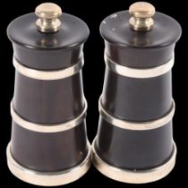 A pair of turned wood and silver-mounted salt and pepper grinders