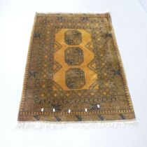 A mustard-ground Afghan rug. 145x105cm.