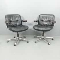 A pair of mid-century leather upholstered swivel desk chairs in the manner of the Gordon Russell