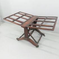 A 19th century rosewood folio stand. Dimensions (folded) 66x110x74cm, opening to 116cm.