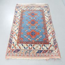 A cream-ground Turkish rug. 178x107cm.