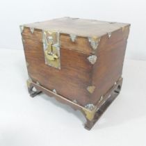 A Chinese elm box on stand, with brass mounts and lock. 48x46x40cm. Good used condition. Various