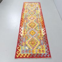 A Chobi Kilim runner. 250x74cm.