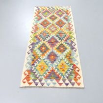 A Chobi Kilim Runner. 149x64cm.