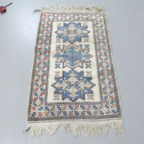 A cream-ground Turkish rug. 120x75cm