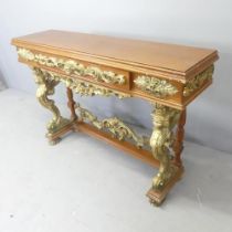 A modern mahogany and gilt painted console table, with single drawer, and applied carved and pierced