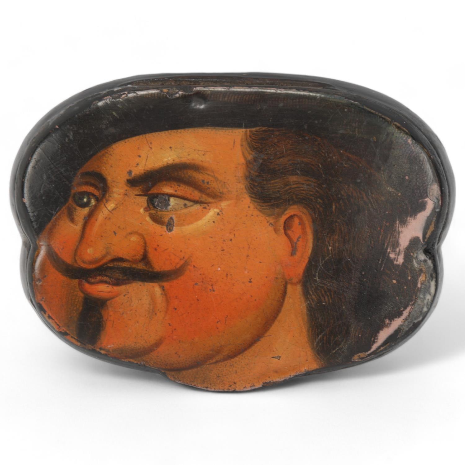A 19th century lacquer snuffbox, the lid having a painted portrait of a gentleman, length 7cm