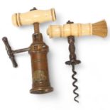 Mid-19th century brass barrel type corkscrew, with bone handle and coat of arms, together with