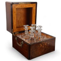 A 19th century rosewood and marquetry inlaid liqueur decanter set, cast-brass carrying handles,