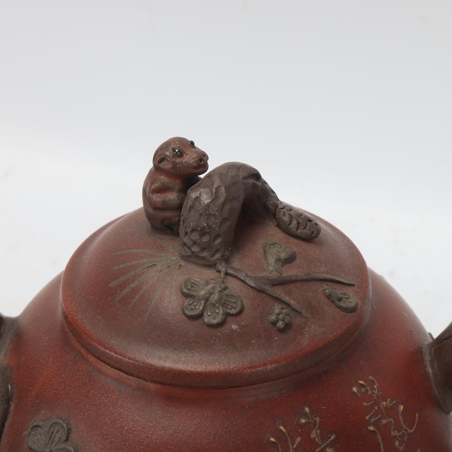 A Chinese Yixing style teapot with monkey knop, character marks to base and sides, height 12cm - Image 2 of 3