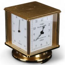 A modern 4-faced revolving desk clock, hygrometer, barometer and thermometer, by Sewills of