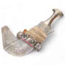 An Oman ceremonial jambiya dagger, late 19th/early 20th century, with horn handle and woven fabric