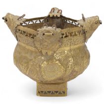 A brass hanging censer, Chinese or Tibetan, with dog of fo suspension mounts and embossed