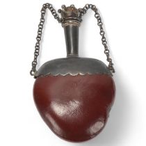 A small 19th century Chinese perfume flask made from a seed pod, with unmarked white metal mount,