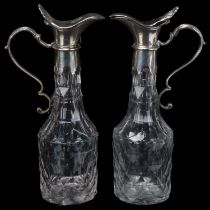 A pair of 19th century cut-glass flagons, with plated tops and armorial crests, height 18cm Both