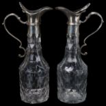 A pair of 19th century cut-glass flagons, with plated tops and armorial crests, height 18cm Both