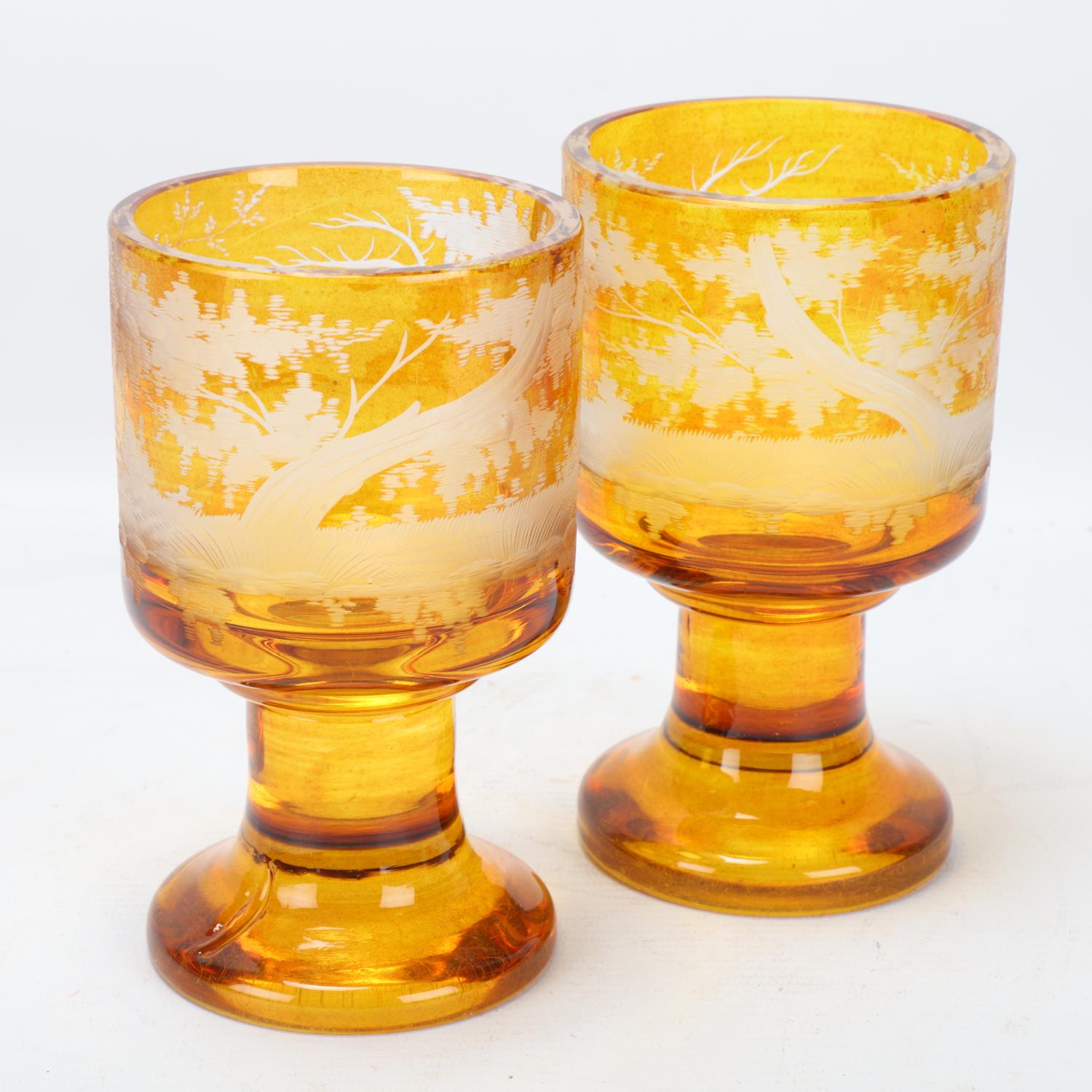 Pair of 19th century Bohemian amber overlay glass goblets, with engraved stags, on heavy bases, - Image 2 of 3