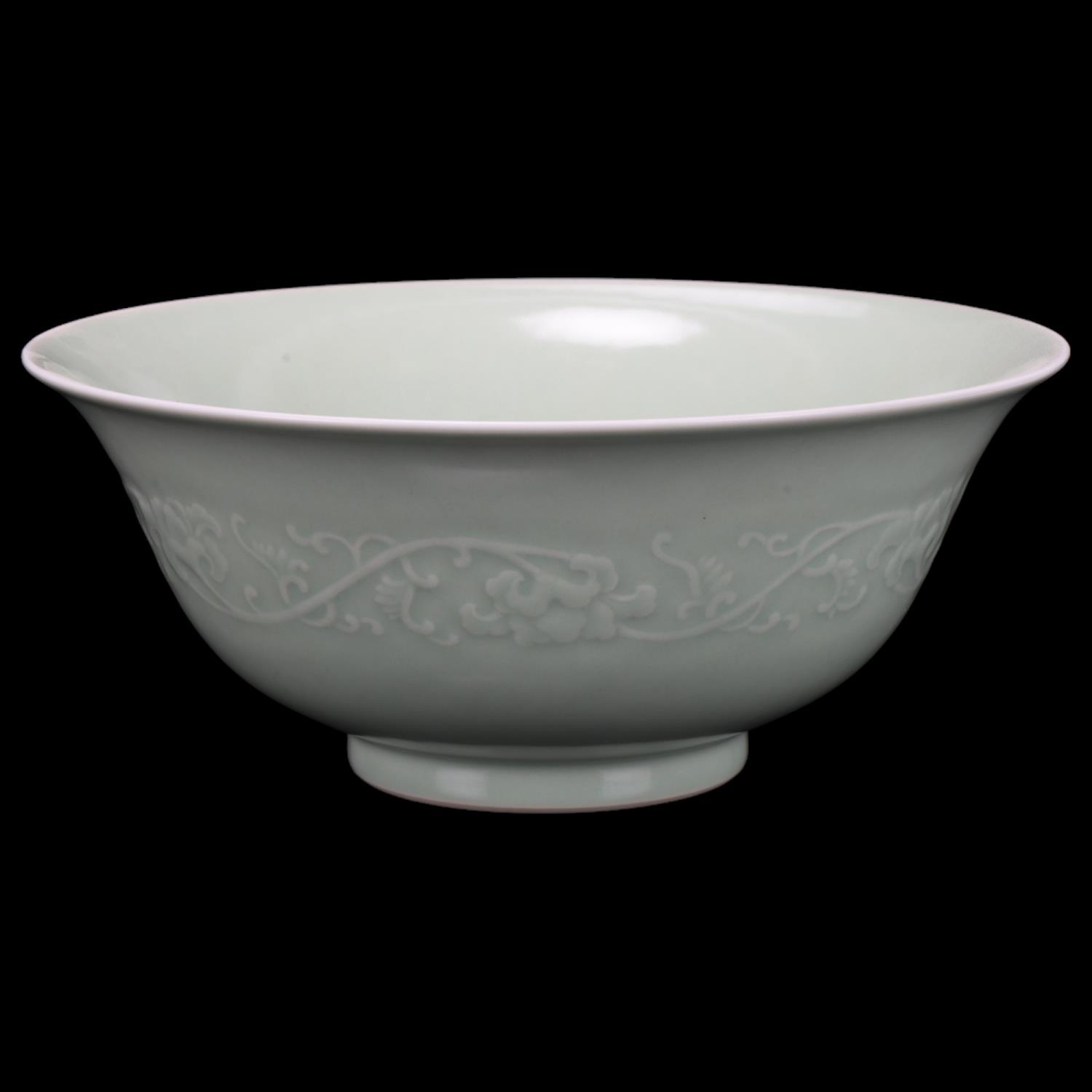 A Chinese celadon porcelain bowl, relief moulded frieze and seal mark, diameter 22cm No chips cracks