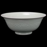 A Chinese celadon porcelain bowl, relief moulded frieze and seal mark, diameter 22cm No chips cracks