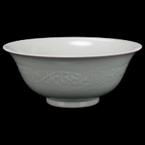 A Chinese celadon porcelain bowl, relief moulded frieze and seal mark, diameter 22cm No chips cracks