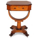 A 19th century maple sewing table with rising top, yoke-shaped stretcher and carved feet, 52cm x