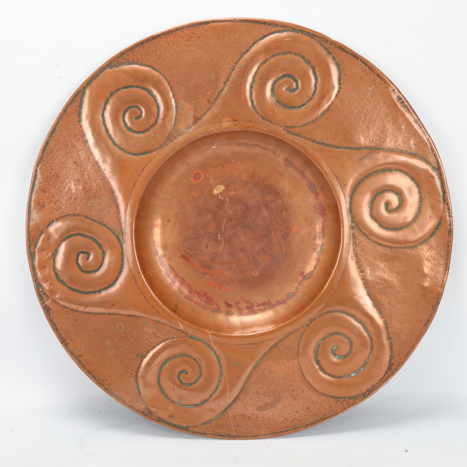 An Arts and Craft embossed copper tray on stylised brass stand, no maker's marks, diameter 42cm No - Image 2 of 3