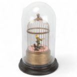Reuge Music, bird in a cage automaton, brass cage with musical mechanism, height 28cm, with wooden