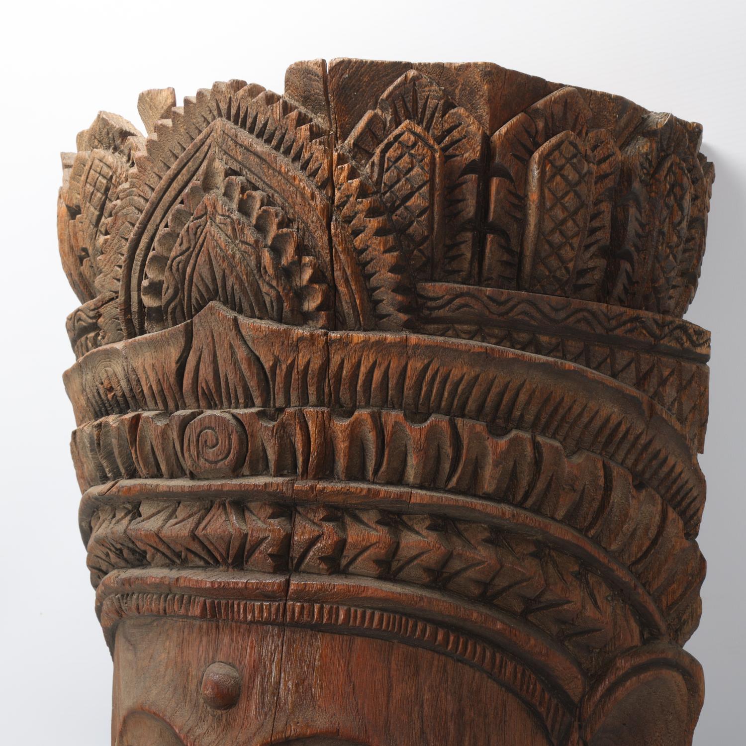 A large Burmese relief carved wood mask wall carving, height 67cm - Image 2 of 3