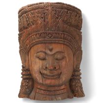 A large Burmese relief carved wood mask wall carving, height 57cm