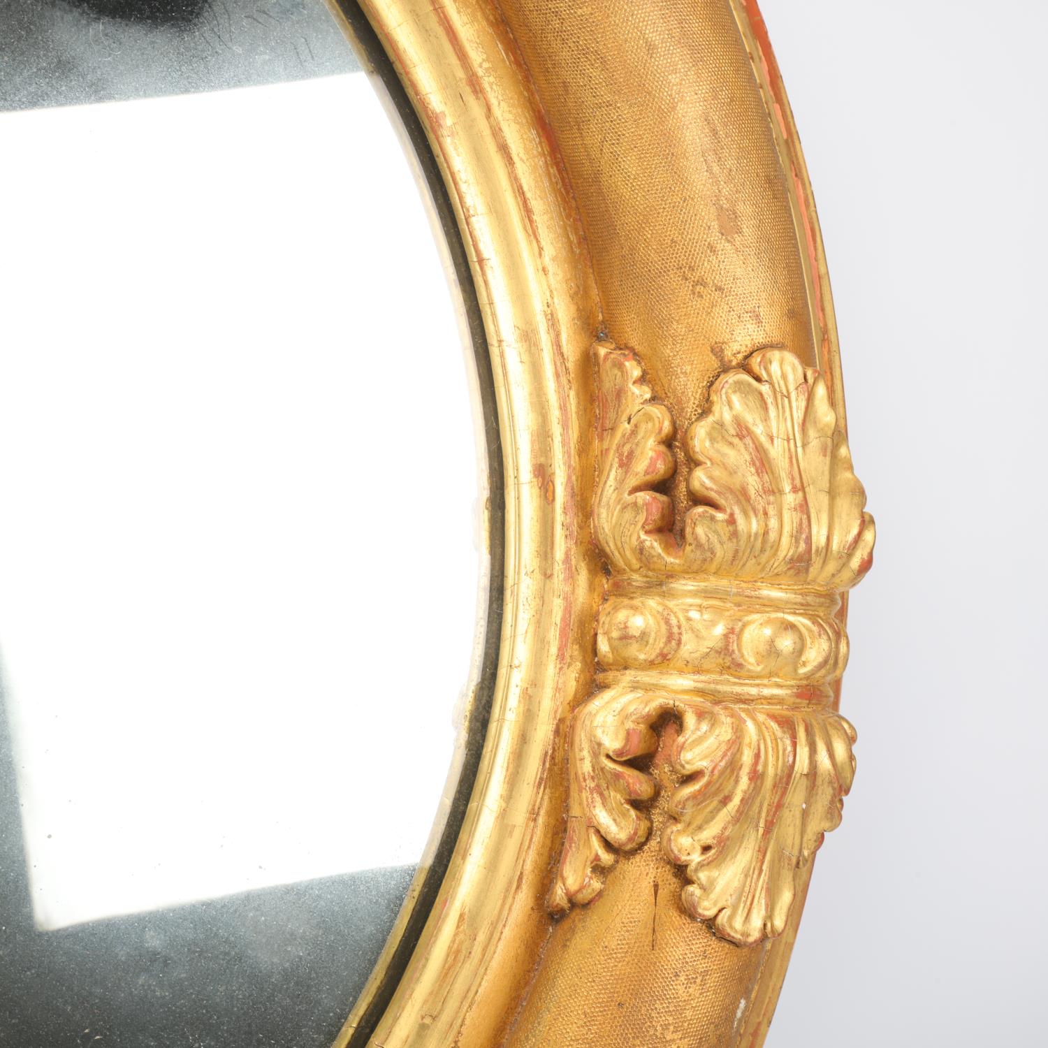 An early 19th century circular gilt cushion-framed wall mirror, with relief acanthus leaf gesso - Image 2 of 3