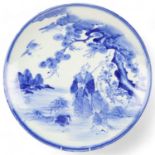 Large Chinese blue and white porcelain charger, hand painted scene depicting figures in a garden,