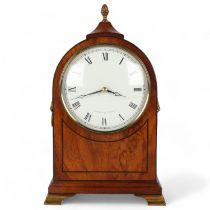 A reproduction mahogany cased dome-top mantel clock, on brass bracket feet, by Comitti of London,