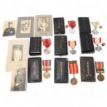 A collection of Japanese medals, in original cases, together with military portrait photos