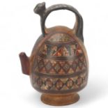 A 16th century Peruvian terracotta ceremonial chicha pot, with puma handle and geometric painted