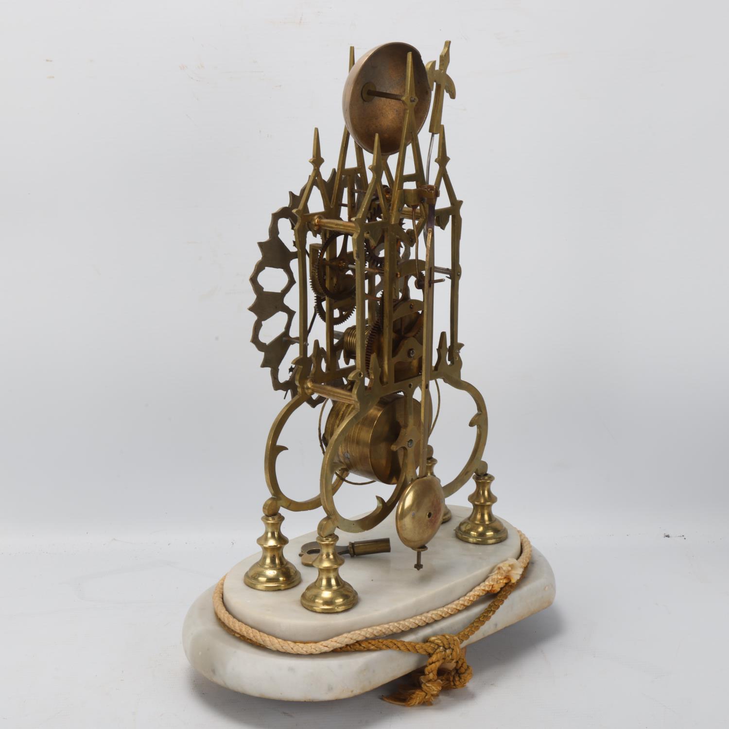 A Victorian brass skeleton clock, single fusee movement, under glass dome on marble base, overall - Image 2 of 3