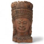 A large Burmese relief carved wood mask wall carving, height 67cm