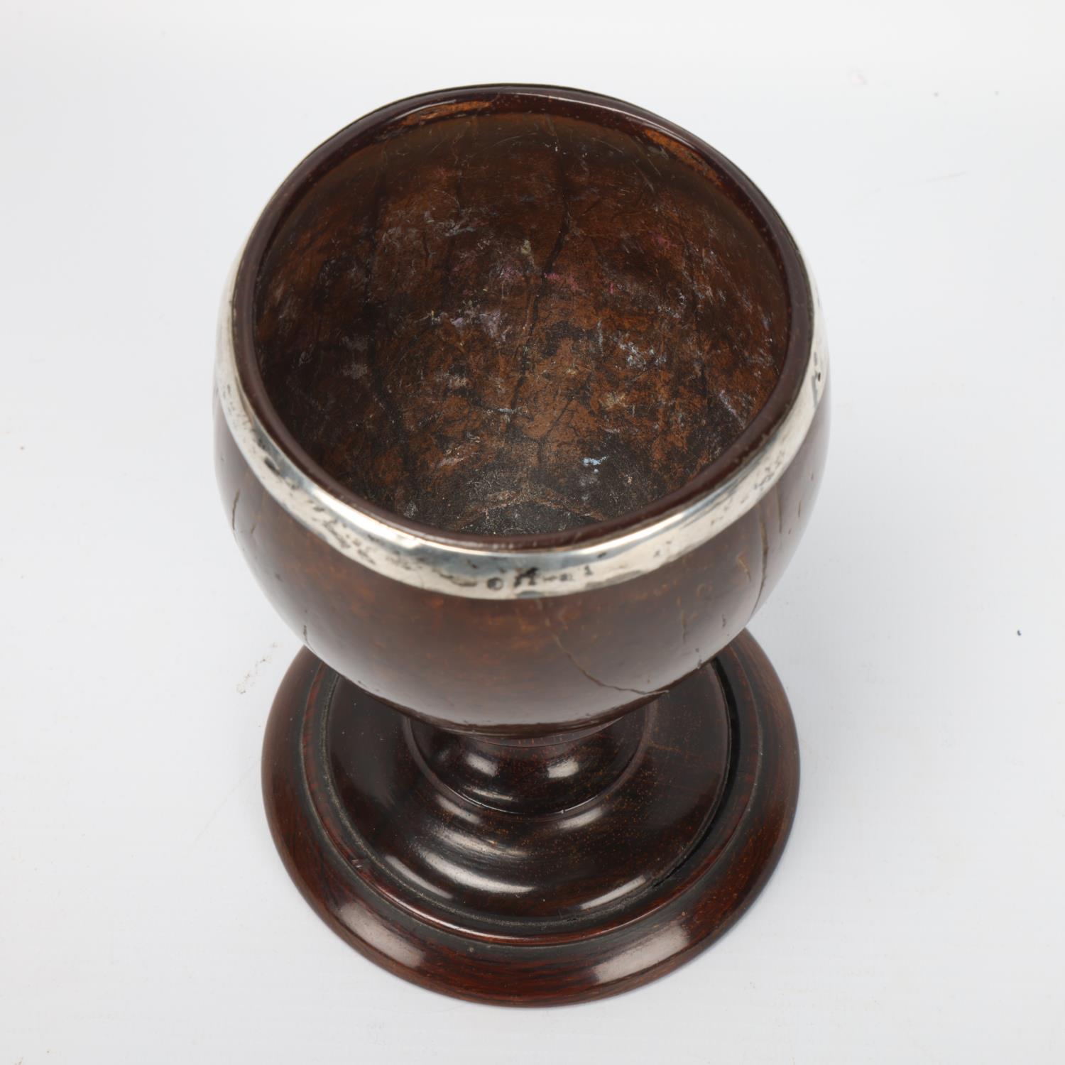 Antique coconut cup, 18th or 19th century, unmarked white metal mounts on rosewood base, height 14. - Image 2 of 3