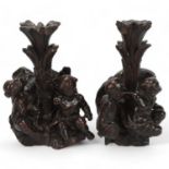 Pair of Antique carved wood newel posts converted to candle holders, each decorated with Classical