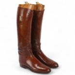 Pair of Victorian brown leather riding boots, with brass-mounted wooden trees Good condition,