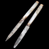 Pair of Georgian mother-of-pearl handled knives, with unmarked yellow metal mounts and steel blades,