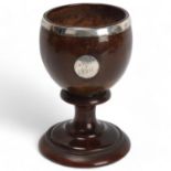 Antique coconut cup, 18th or 19th century, unmarked white metal mounts on rosewood base, height 14.