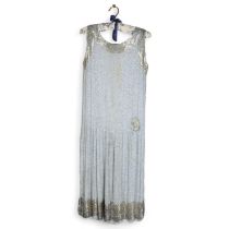 A 1920s flapper dress, with applied beaded decoration, approx size 5