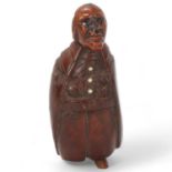 19th century coquilla nut box in the form of a man, height 7cm 1 boot tip is missing, box has been