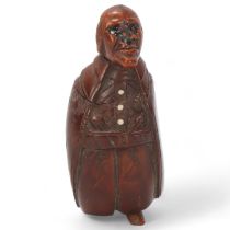 19th century coquilla nut box in the form of a man, height 7cm 1 boot tip is missing, box has been
