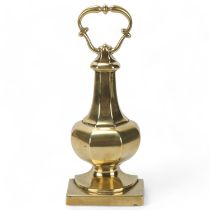 A heavy Victorian brass urn-shaped doorstop, possibly by W Tonks, height 31cm